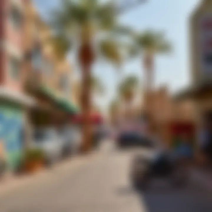 Street view of Al Quoz Camp featuring local businesses and artistic murals.